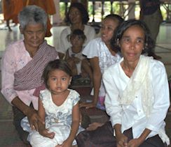 Village people waiting until the monks have eaten.