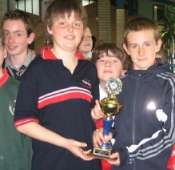 Cillian McCaffrey receiving the Player of The Month Award from last months winner Ethan