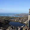 Still lake near the Copper mines. Rough sea in the distance. One of the markers for the Beara way walk.