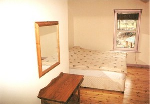 A view of a family room with double bed. Childrens bunks and cots are also available.