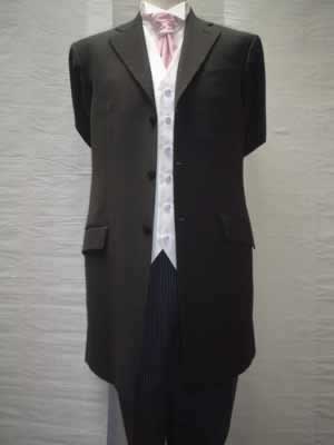 Lightweight black three-quarter suit with white waistcoat and pink cravat