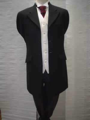 Black Prince Edward jacket with grey stripe trousers and plain ivory waistcoat