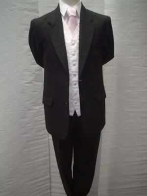 Black herringbone jacket with matching trousers, pink swirl waistcoat and pink tie