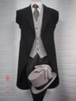 Black herringbone tailcoat with traditional grey stripe trousers and pearl grey waistcoat (7kb)