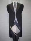 Black tailcoat with traditional grey stripe trousers, top hat and cane (6kb)