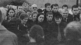 Mrs Marion Bennett pictured at the graveside with her daughter Sinead and son Cathal.