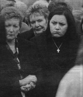 Mrs. Marian Bennett and daughter Sinead pictured at the graveside.