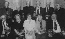 Pictured at the awards presentation are award winners (sitting, left to right): Packie J.McNelis, Hilda Hanlon, Nan McGill, Eileen Breslin, Tommy Maloney. (Standing, left to right): Thomas Boyle, Danny Haughey, Rev. Fr. A.Laverty, Hughie Gavigan, Seamus Gallagher, John F.Gallagher