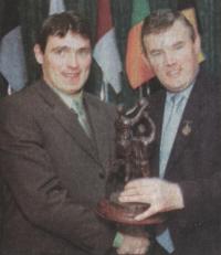 Martin Gavigan, being presented with his award by GAA President Sean McCague