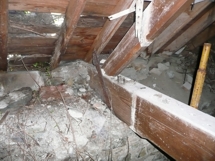 Rotten roof timbers and damaged masonry, nave north wall