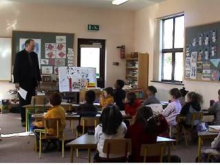 Fr. O'Farrell in classroom.