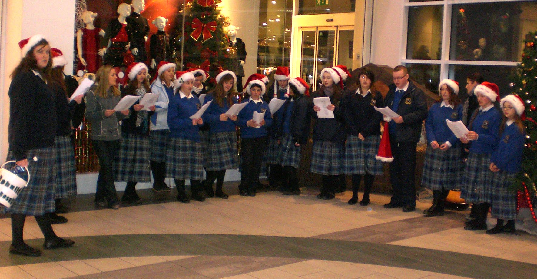 Confey College Choir at Christmas singing in the Manor Mills Shopping center in Maynooth, Kildare.