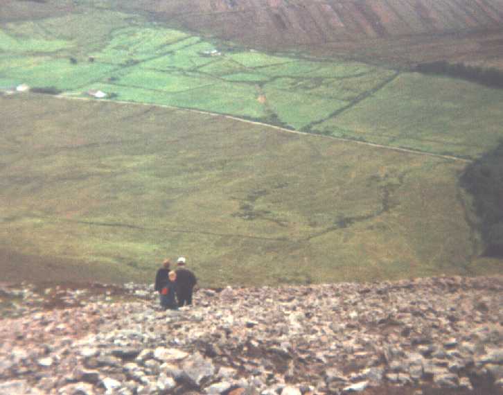 The scree that covers the side of the Reek leaves a very precarious foothold