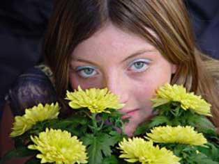 Girls smelling flowers