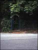 A green gate with the words 'Killiney Hill' written in white