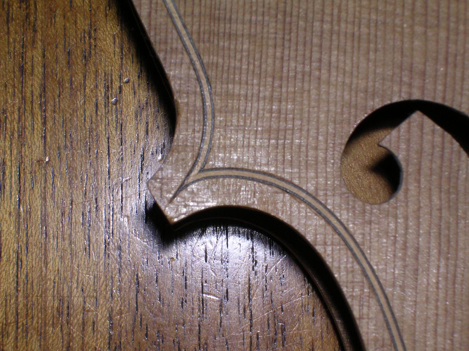 Detail of the beesting joining of the purfling at the points of the 'C' bout.