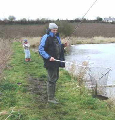 Chris Reed safely lands one of his winning fish