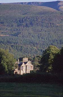Muckross House with the impressive backdrop of Mangerton and the Devil's Punch Bowl (photo Mike Sandover)