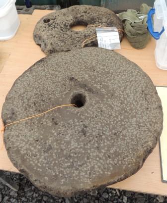 Top and bottom quern stones for grinding corn.