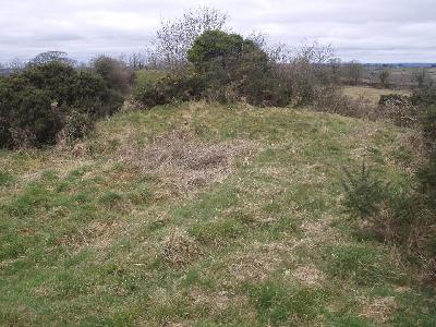 View of south side of mound at Fourknocks II with top of Fourknocks passage tomb visible