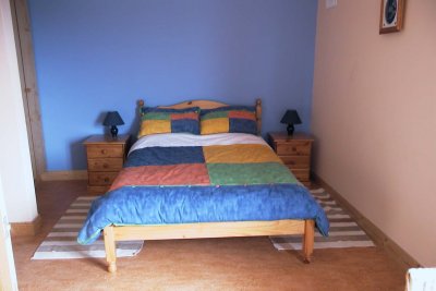 The master bedroom with ensuite wetroom to the left and extrawide access doors