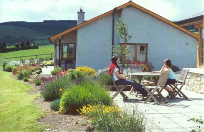 Holiday makers enjoying the sunshine and tranquility on the patio
