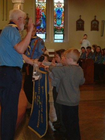 Terry Cullen Investing some Beavers into the Scout Movement