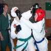 Dave attempts to rip Karls head guard off.