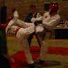 Lorkin knocs Chris over with a turning kick.