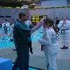 Ciara is presented with her medal by Sean Keane.