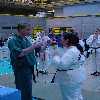 Eva Doyle is presented with her medal by Sean Keane.