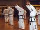The black belts doing their patterns.