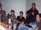 The lads singing in the sitting room of one of the houses.