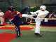 Jonathon gets a kick in against his kickboxer opponent.